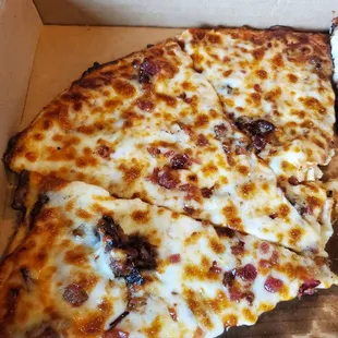 two slices of pizza in a box