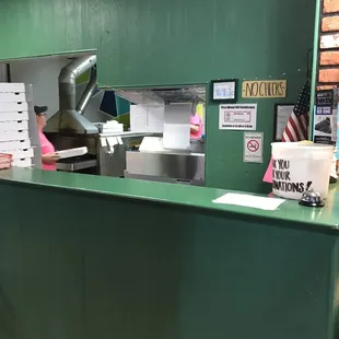 a counter with a pizza cutter