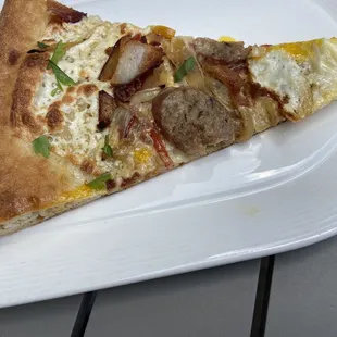 The breakfast slice that the chef gave us. Tasted like sausage and peppers meets breakfast meets perfectly cooked dough. Was so good!!