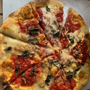 Margarita pizza with mushrooms added. The sauce was way too sweet and they barely put any toppings on it.