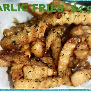 Garlic fries $4.99, regular fries $4.50 as of March 2024.