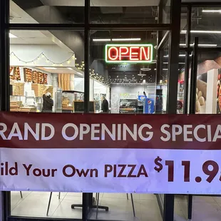 grand opening special build your own pizza $ 1 99