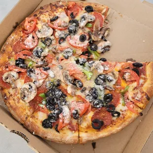 a half eaten pizza in a box