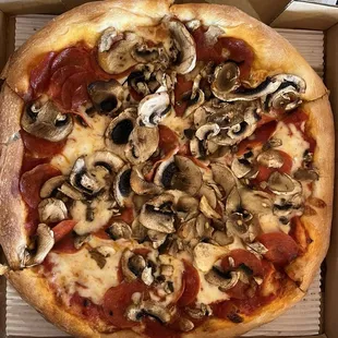 Competitor's same pepperoni and mushroom pizza.