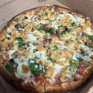 cauliflower crust pizza with chicken, spinach, mushrooms, and onions! Absolutely the best cauliflower crust pizza!