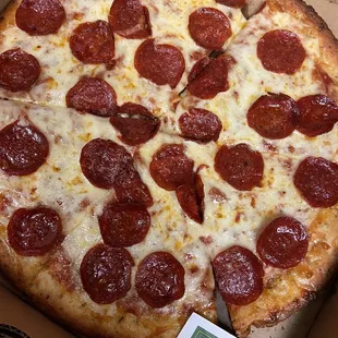 a pepperoni pizza in a box