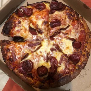 Large pepperoni and bacon with extra cheese extra pepperoni and bacon. This pizza has neither and it's burnt!