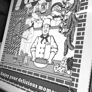 a black and white photo of a pizza