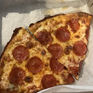 two slices of pepperoni pizza