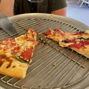 a man eating a slice of pizza