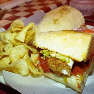 Chicken Parm Sub (added cheese and pepperoncinis) with a side of Chips and Italian coleslaw (included). A must try!
