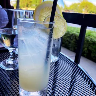 a glass of lemonade on a table