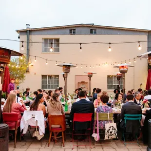 a large group of people eating outside