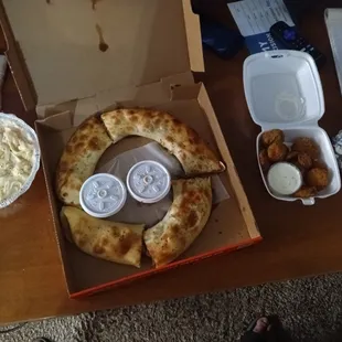 a pizza in a pizza box with a slice cut out of it