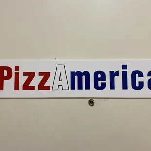 a pizza america sign on a wall