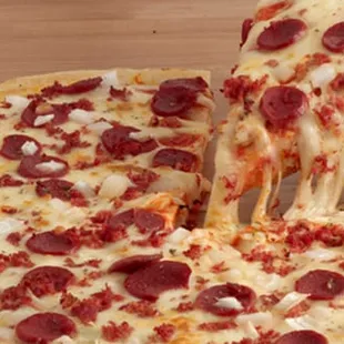 a slice of pepperoni pizza being lifted by a fork
