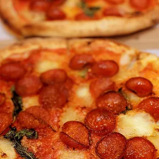 two pepperoni pizzas