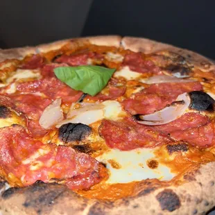 a pepperoni and onion pizza