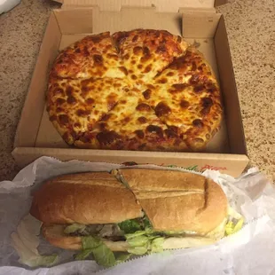 Small cheese pizza and a cheesesteak.