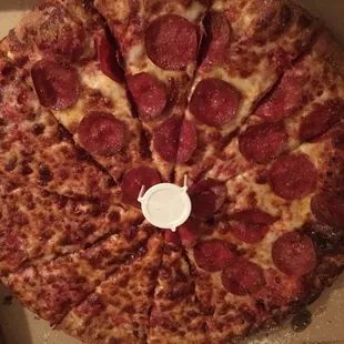 Their large pizza with half pepperoni and half cheese. It&apos;s baked in a oven that rolls through very much like Costco