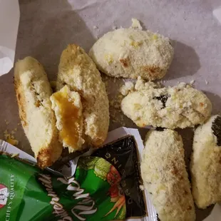 this is the jalapeno poppers. raw flour falling off. absolute ridiculous. also, somehow took an extra 90 min to deliver without cooked.