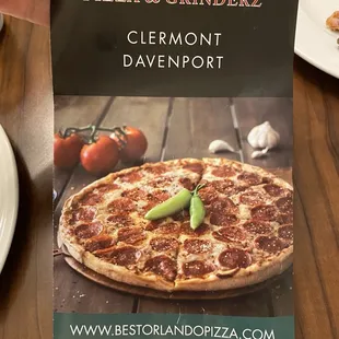 a hand holding a menu