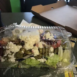 a salad in a plastic container