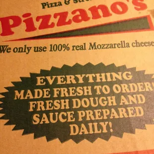 a pizza box with a large pizza on it