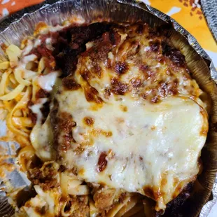 Chicken Parmigiano the corners you can&apos;t see because they are black burnt is not a shadow  again with the same dry salty sauce.