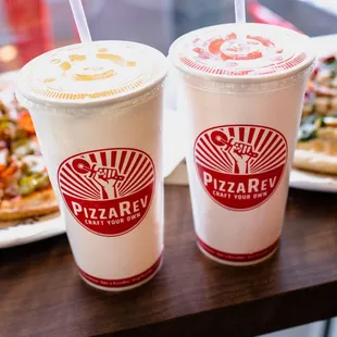 two drinks and a plate of pizza