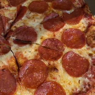 a pepperoni pizza in a box