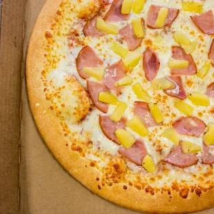 Hang loose with our Hawaiian Pizza! - Ham, Pineapple and extra cheese $8.50