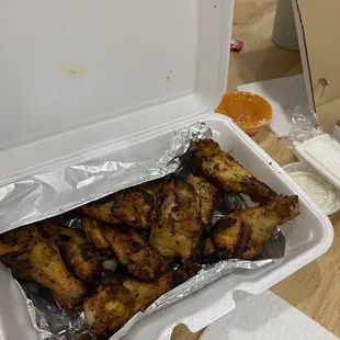 chicken wings in a styrofoam container