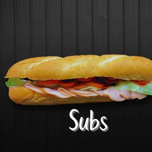 a sub sandwich on a black background