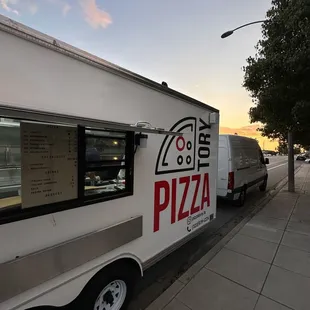 a delivery truck parked on the side of the road