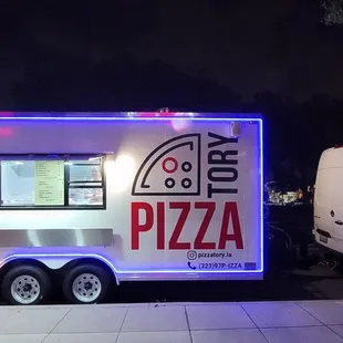 a food truck parked on the side of the road