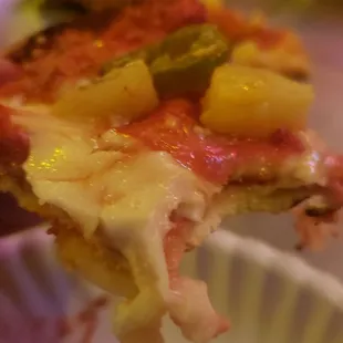 a slice of pizza being eaten