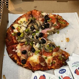 a half eaten pizza in a box