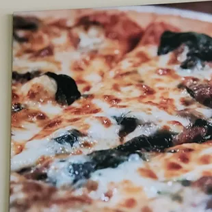 a close up of a pizza