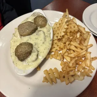 Fettuccine Alfredo with meatballs and waffle fries