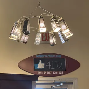 Just noticed the cheese grater chandelier lol love it