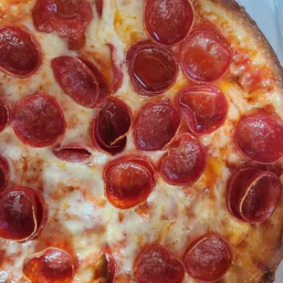 Pizza with grease all over pepperoni