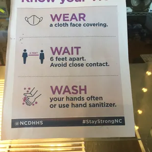 a sign stating to wear a cloth face covering