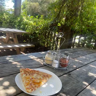 a slice of pizza on a plate