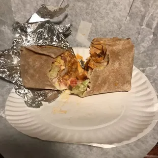 a burrito on a paper plate