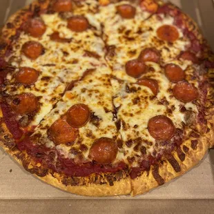 a pepperoni pizza in a box