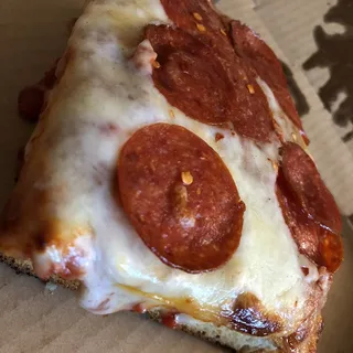 Sicilian Style Deep Dish Pizza Slice