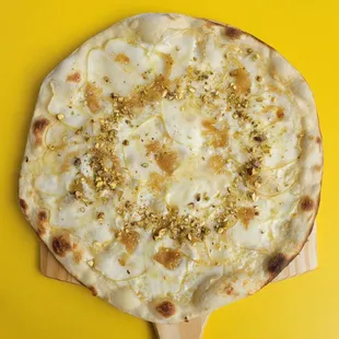 a pizza on a wooden board