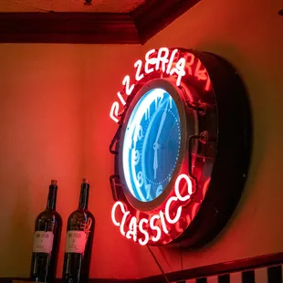 The neon clock contributes to the overall &quot;classic&quot; vibe of Pizzeria Classico.