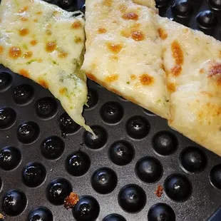 Pizza chips, pesto and garlic shown